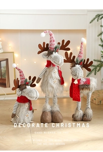 Three plush Christmas reindeer figurines in grey and red knit for festive home decor