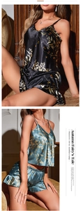 Close-up of floral print satin pajama set with V-neck camisole and ruffled shorts details