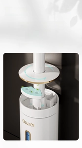 Detail of wall-mounted toilet brush base with built-in fragrance compartment and balm