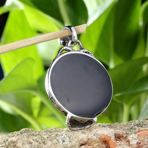 Punk style stainless steel skull mirror pendant with black stone and textured silver edges