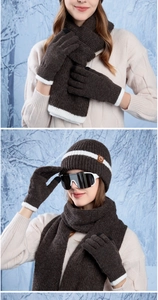 Detail of warm winter knit set with touchscreen gloves and striped beanie in brown