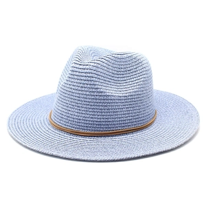Detailed texture of light blue woven straw Fedora hat with brown rope decorative band