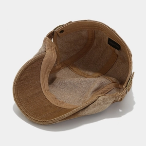 Detail of brown ivy cap showing 100% cotton label, sweatband and inner lining fabric