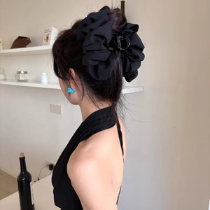 Large black fabric bow hair claw clip for voluminous summer hairstyles and updos