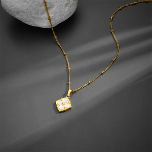 Retro titanium steel gold necklace featuring a white shell petal pendant on a beaded chain