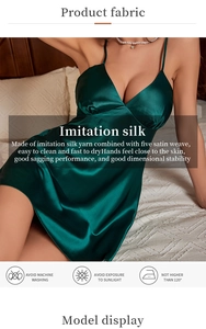 Detail of dark green imitation silk slip dress showing smooth texture and satin luster