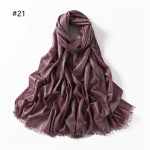 Long wine red scarf with silver glitter threads and fringe edges in a solid color design