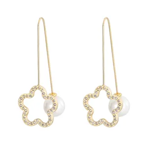 Elegant gold clover earrings with sparkling rhinestones and white round pearls for women