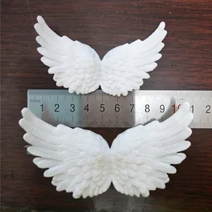 White angel wings craft accessories with feather texture for DIY cake decoration
