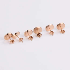Rose gold stainless steel round stud earrings in multiple sizes with butterfly backing