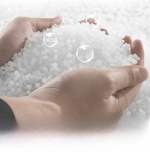 Close-up of smooth heat-resistant PVC resin granules used for transparent coin purses