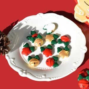 Christmas bell and star resin charms with green bows for festive DIY crafting and decor