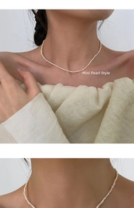 Detail view of mini freshwater pearls on a 14K gold-filled choker necklace for women