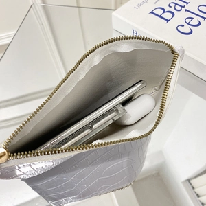 White faux leather pouch with crocodile pattern and golden zipper for phone and makeup