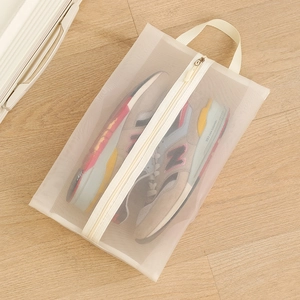 Portable white mesh travel shoe storage bag with zipper and handle for sneakers