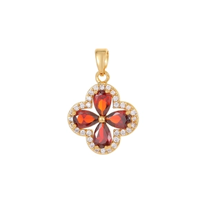 Elegant four-leaf clover pendant in gold with red teardrop zircons and white crystals