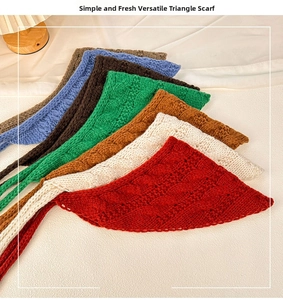 Detail of knitted triangle headscarves showing various colors and cable knit texture