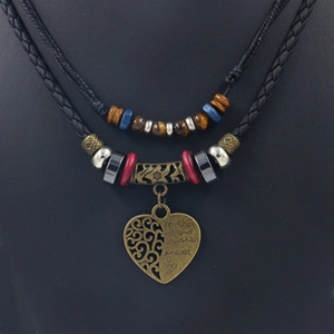 Detail of multi-layer tribal necklace with heart pendant and Mother and daughter forever text