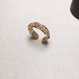 Detail of 14K gold filled handmade wire wrapped ring with pink and green crystal beads