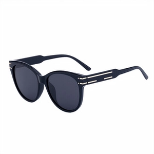 Detail of black rimless sunglasses with leopard head accent and wood grain temples