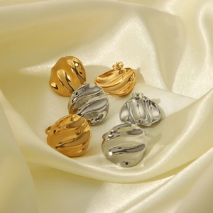 Modern wavy textured round stud earrings in 18K gold and silver plated stainless steel