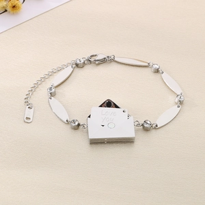 Polished silver envelope bracelet with Love You engraving and sparkling diamonds