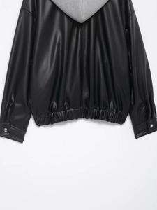 Detail of faux leather jacket featuring grey hood and elasticated ribbed hemline