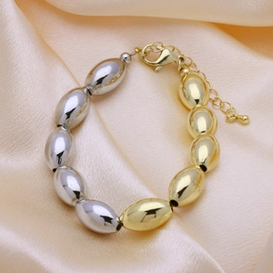 Minimalist 18k gold and silver dual-tone mixed bead bracelet with a lobster clasp