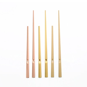 Minimalist metal quartz clock hands set in rose gold, gold, and champagne gold finishes