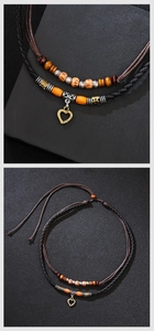 Detail view of double-layer woven cord anklet with wooden beads and golden heart pendant