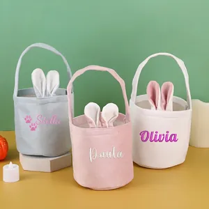 Three embroidered Easter bunny ear baskets in pastel blue pink and beige soft velvet