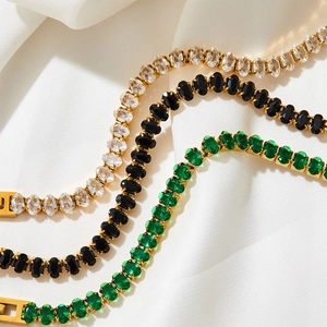 French retro gold tennis bracelets with emerald, black and clear oval zircons