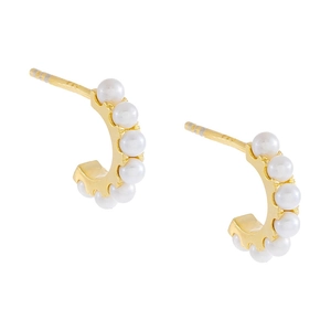 Macro shot of 925 sterling silver stamp on C-shaped pearl earring with gold plating