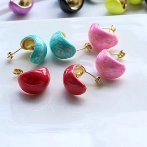 Chic colorful enamel C-shape stud earrings in various vibrant colors on white background
