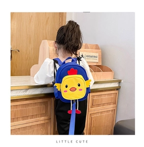 Detail of cute yellow chicken toddler backpack with blue anti-lost safety leash