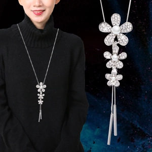Elegant white pearl flower sweater necklace with rhinestone pavé and metal tassels