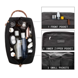 Detail of men's canvas toiletry bag internal pockets and front compartment design