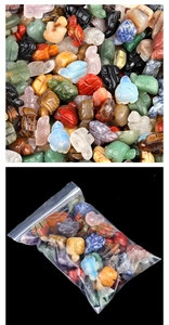 Macro shot of assorted natural crystal turtle figurines stacked and in retail packaging