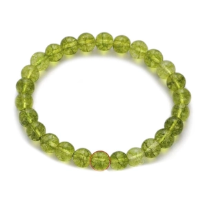 8mm green peridot distance bracelet with natural stone beads on a white background