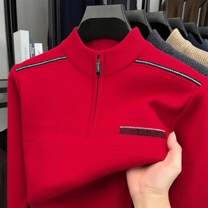 Close-up showing the high elasticity of red knitted half-zip sweater fabric