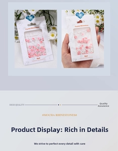 Detailed view of pink resin rose and pearl nail art charms in hanging window card