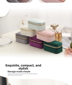 Travel velvet jewelry boxes in six colors with gold zippers on a white vanity