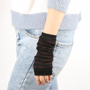 Close-up of black and brown striped knit arm warmers with a fingerless sleeve design