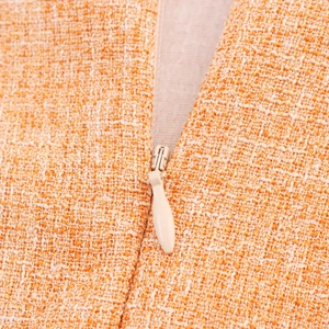 Ensemble jupe et gilet en tweed orange avec fermeture éclair invisible au dos