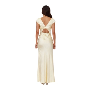 Elegant backless satin maxi dress in cream yellow featuring a deep V crisscross back design