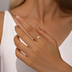 Macro view of adjustable S925 silver gold chain ring with sparkling butterfly zircon
