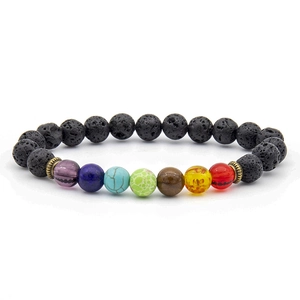 Macro shot of colorful seven chakra lava stone beads with tiger eye and antique metal spacers