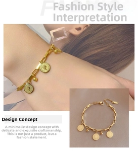 Detail of 18k gold plated titanium bracelet with queen coin charms and ball pendants