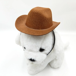 Close-up of a brown felt pet cowboy hat with adjustable elastic strap on a plush dog toy
