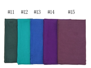 Flat lay of soft modal cotton hijabs in deep green, blue, and purple color variants